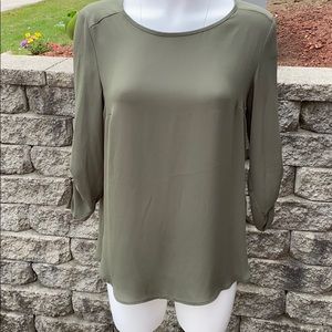 Green blouse with gold hardware